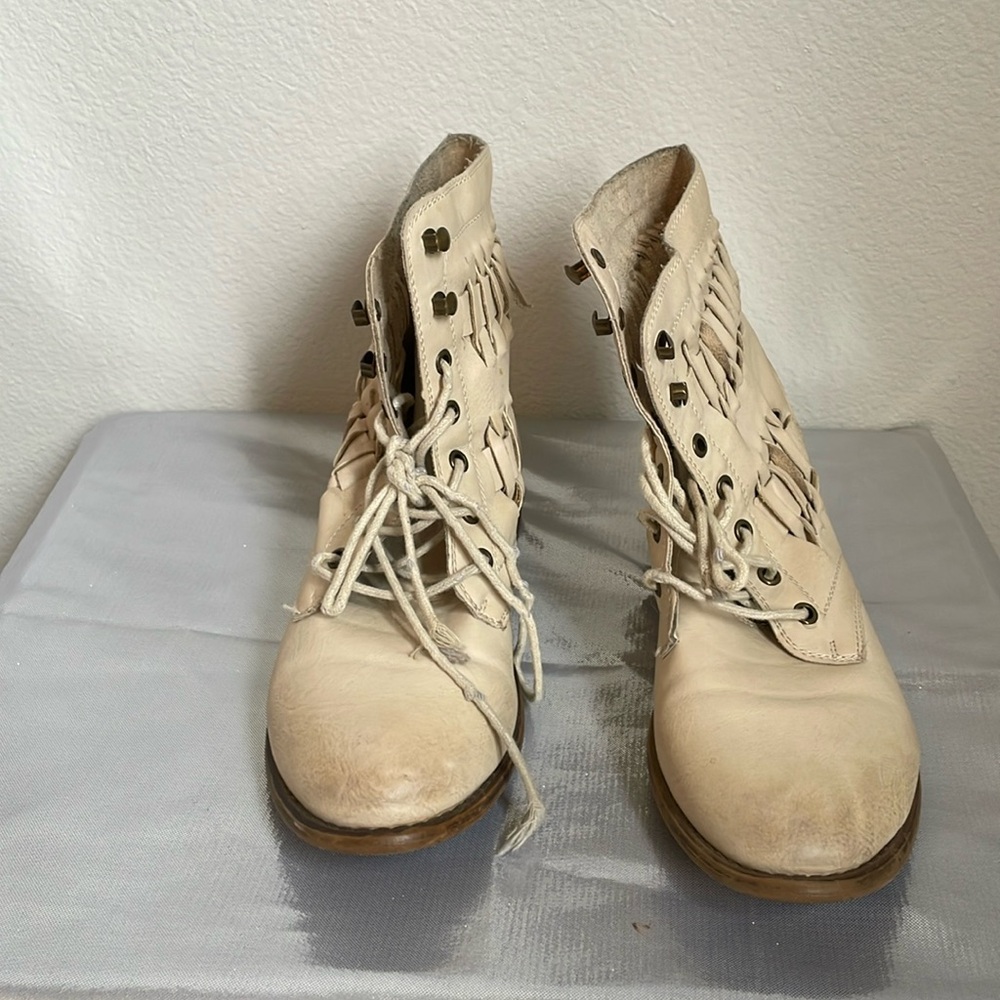 Beige military boots, some wear, lots of life left